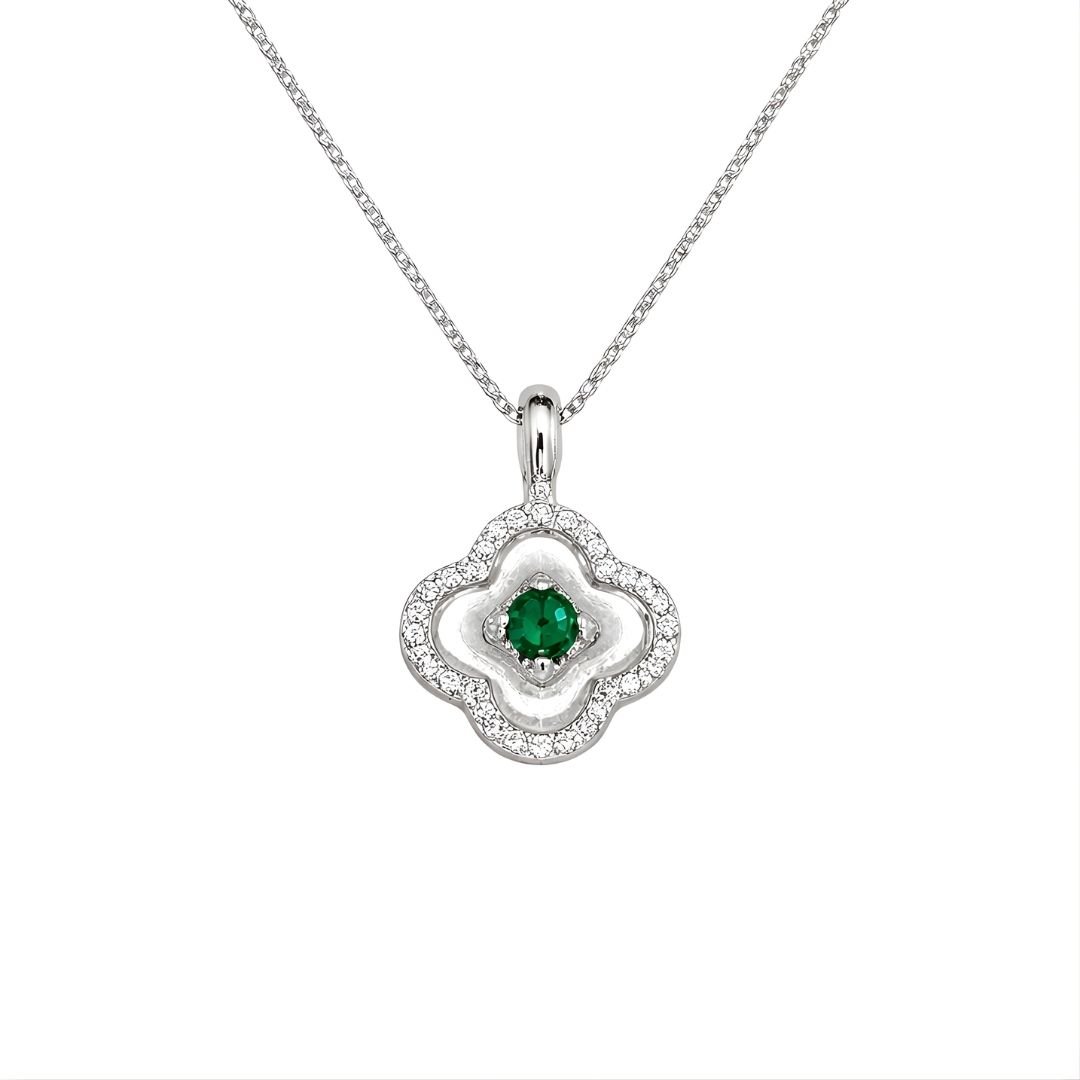 Sterling silver four-leaf clover pendant with a green emerald center and sparkling cubic zirconia.