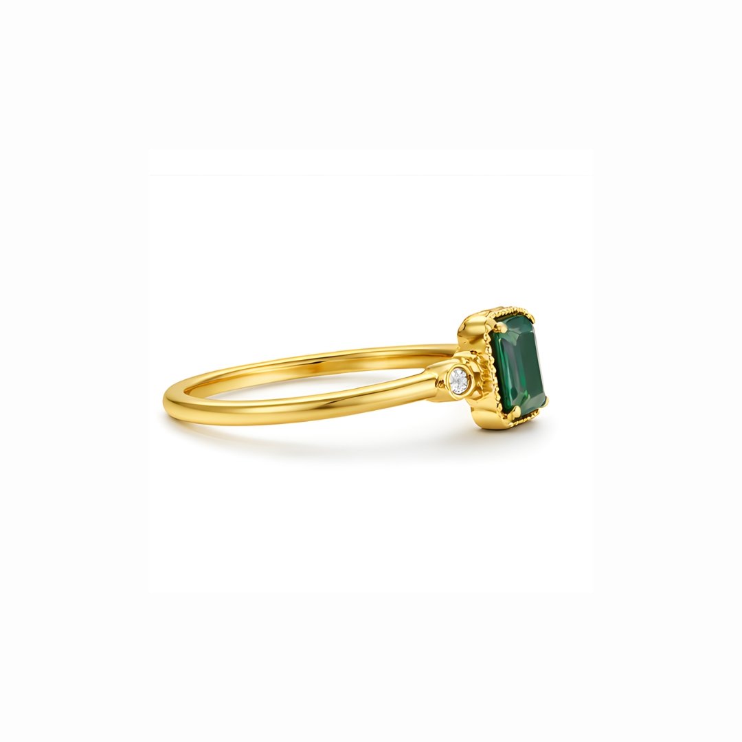 S925 gold-plated ring with emerald-cut green stone and side accents