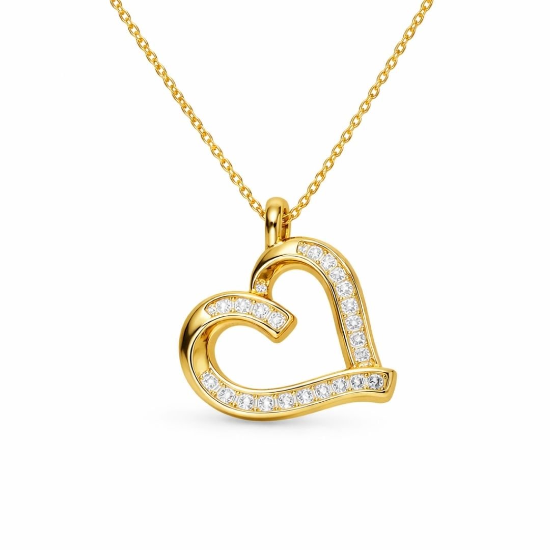 Gold plated sterling silver open heart pendant with cubic zirconia crystals.